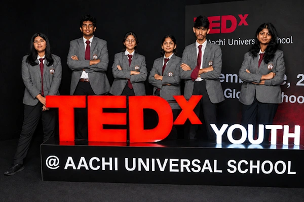 CBSE higher secondary school for grades XI and XII in Vanagaram featuring students posing at TEDx.