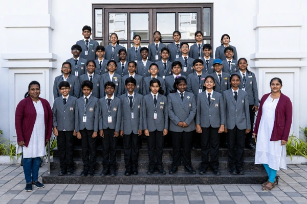 CBSE high school learning environment in Vanagaram featuring students and teachers posing together
