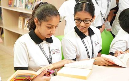High school students reading books together for core learning and critical thinking development.