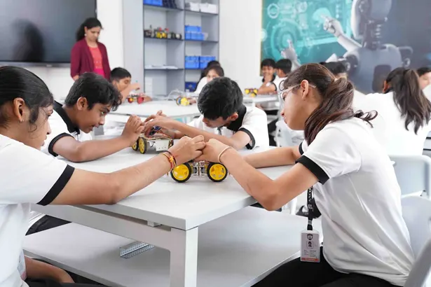 Students exploring technology through hands-on extracurricular learning activities