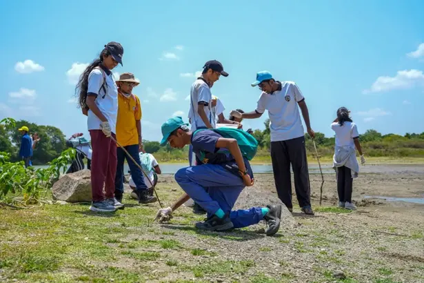 Students participating in outdoor activities that encourage teamwork and responsibility
