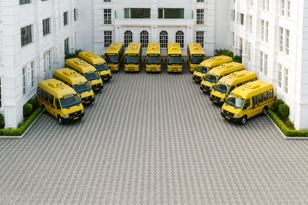 Air conditioned school transport facility in Vanagaram showcasing yellow school buses parked.