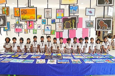 Art education and creative activities for primary school students showing student artwork.