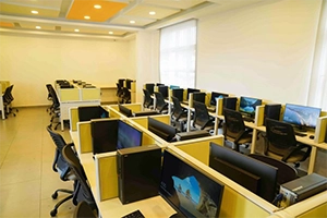 Computer lab setup with modern desktops for coding and IT skills development training.