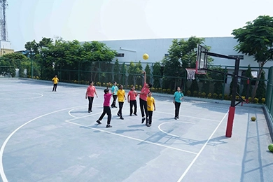 Sports and physical education for student health in Vanagaram playing basketball.