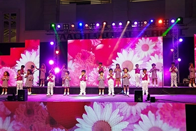 Music and dance activities for primary school students in Vanagaram performing on stage.