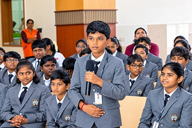 Student speaking to an audience during a school community activity