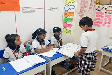School library and reading activities for primary school students with a child reading.