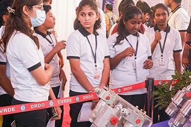 Career exposure and guidance for higher secondary students exploring equipment displays.