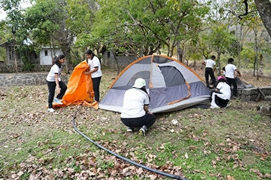 Student clubs and leadership opportunities for high schoolers pitching a camping tent.