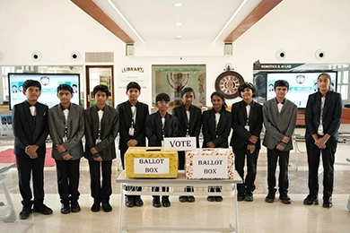 Student leadership development for higher secondary learners standing near ballot boxes.
