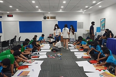 Students working together on a classroom activity to develop teamwork skills