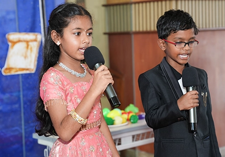Students singing and performing on stage during a school cultural event program live today