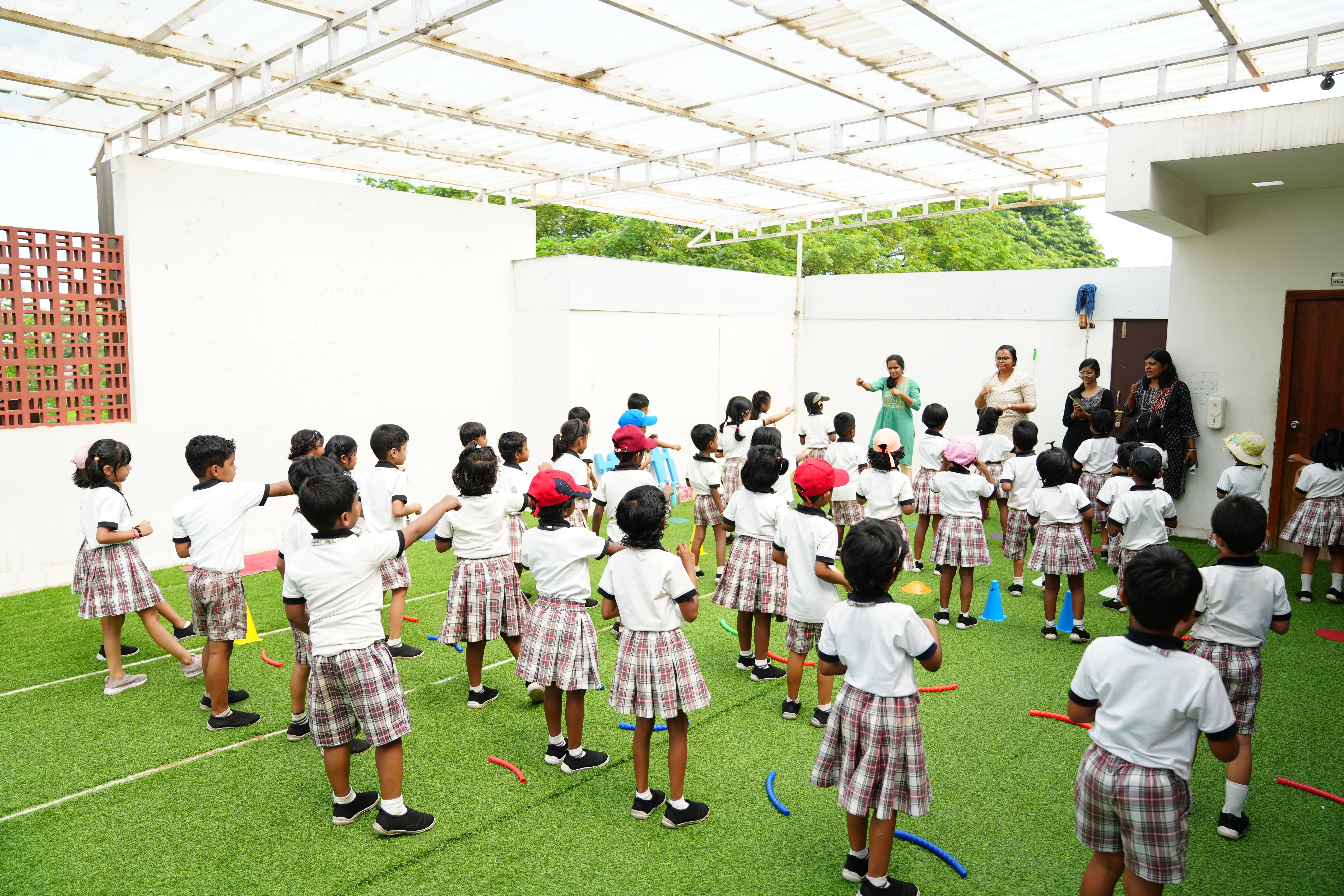 Children taking part in karate training activities during school physical education sessions