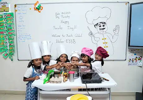 Children taking part in hands-on cooking activities during a practical school learning event