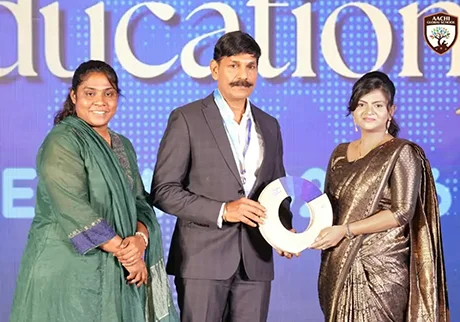 School representatives receiving achievement award during an educational award event today