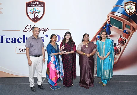 School representatives receiving an excellent school award at a recognition ceremony event