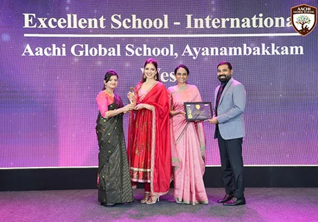 School representatives holding an excellence award during an educational achievement event