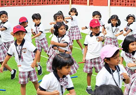 Young students participating in a cultural dance activity during a school event celebration