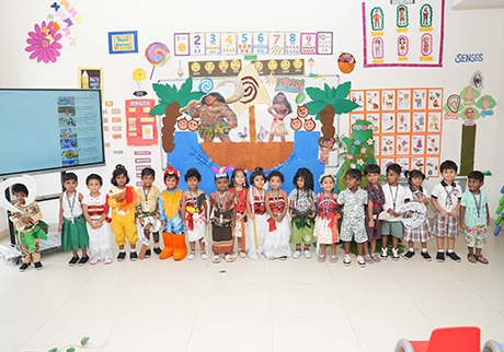 Young students participating in a cultural program with colorful costumes and displays today