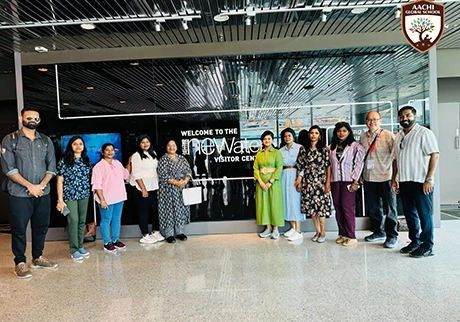 School staff and students participating in an educational trip to Singapore together abroad