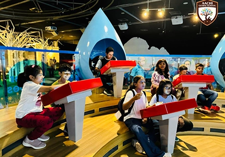 Students participating in gameplay activities during an educational school tour in Singapore
